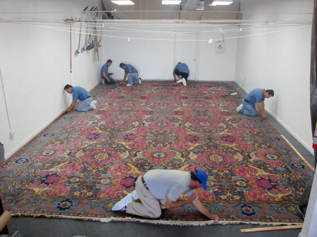 antique Persian area rug, 28' x 18', one of 11 carpets that Interior Technology Services restored for a yacht